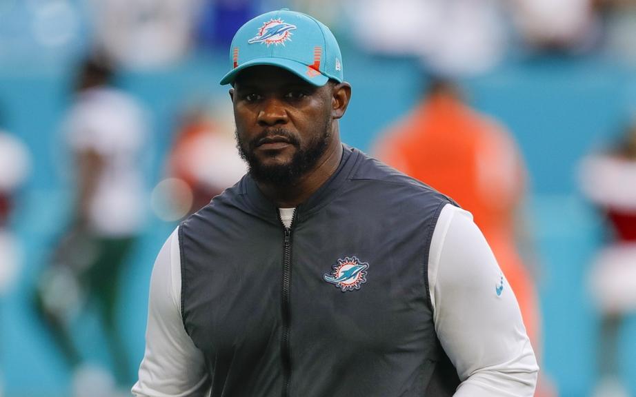 Dec 19, 2021; Miami Gardens, Florida, USA; Miami Dolphins head coach Brian Flores runs off the field after winning the game against the New York Jets at Hard Rock Stadium. Mandatory Credit: Sam Navarro-USA TODAY Sports