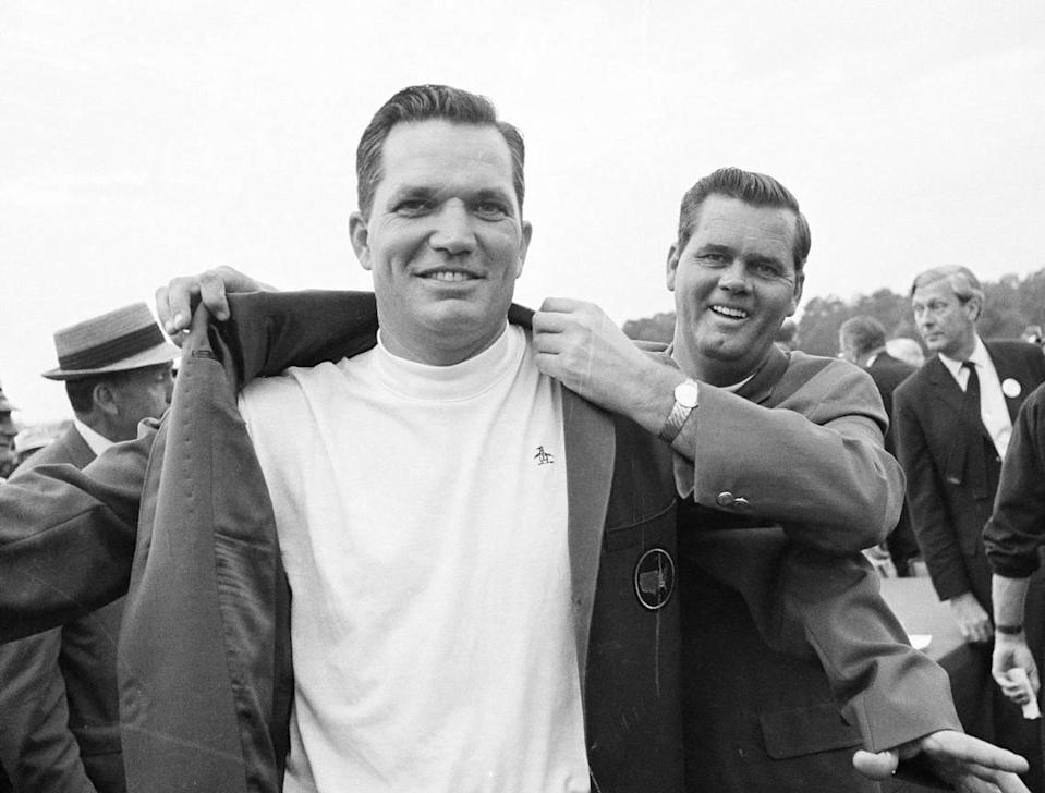 Bob Goalby, left, gets the traditional green coat as champion of the of the Masters Golf tournament at Augusta, Ga., April 14, 1968, from Gay Brewer.