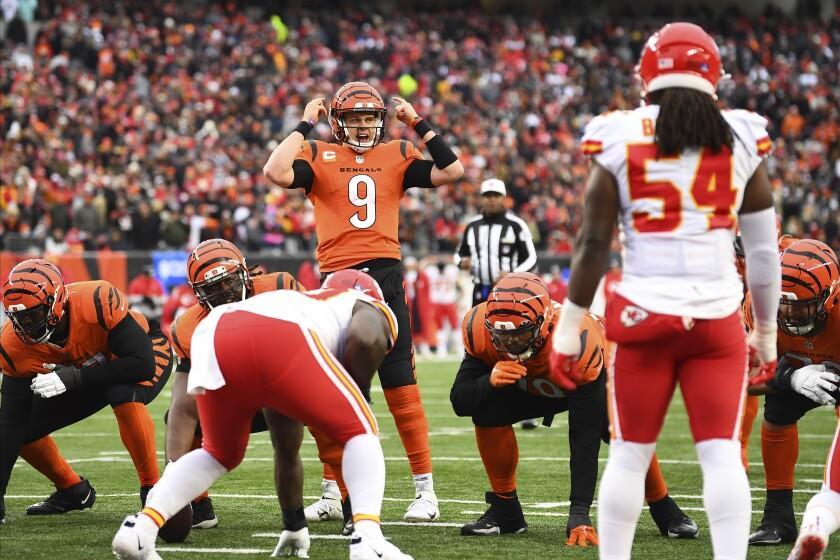 Cincinnati Bengals quarterback Joe Burrow (9) calls a play during an NFL football game against the Kansas City Chiefs, Sunday, Jan. 2, 2022, in Cincinnati. (AP Photo/Emilee Chinn)