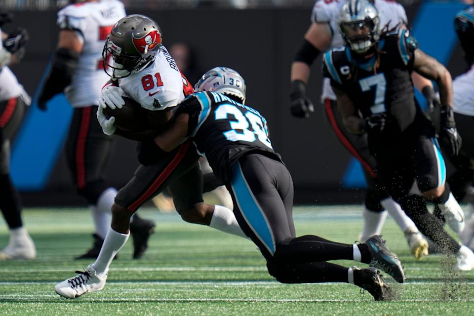 Tampa Bay Buccaneers wide receiver Antonio Brown is tackled by Carolina Panthers defensive back Myles Hartsfield during the first half of an NFL football game Sunday, Dec. 26, 2021, in Charlotte, N.C. (AP Photo/Rusty Jones)