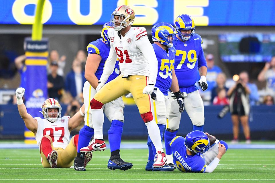 San Francisco 49ers defensive tackle Arik Armstead (91) and defensive end Nick Bosa (97) celebrate after a sack of Los Angeles Rams quarterback Matthew Stafford in Week 18. (Photo by Brian Rothmuller/Icon Sportswire via Getty Images)