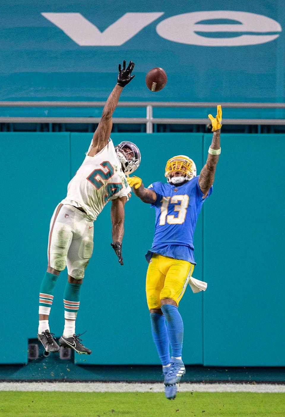 Dolphins cornerback Byron Jones deflects a pass intended for Chargers receiver Keenan Allen during a game last season.