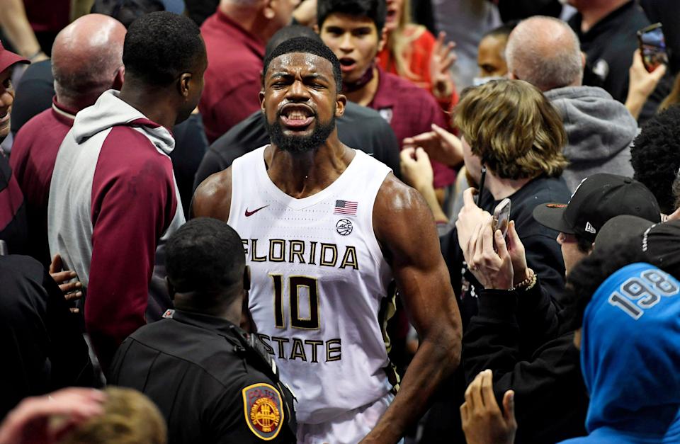 Florida State's Malik Osborne celebrates with fans after the Seminoles upset the No. 5-ranked Duke Blue Devils.