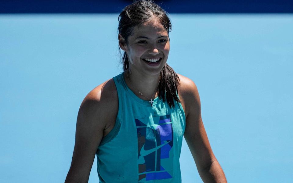 Emma Raducanu smiles during training - AFP