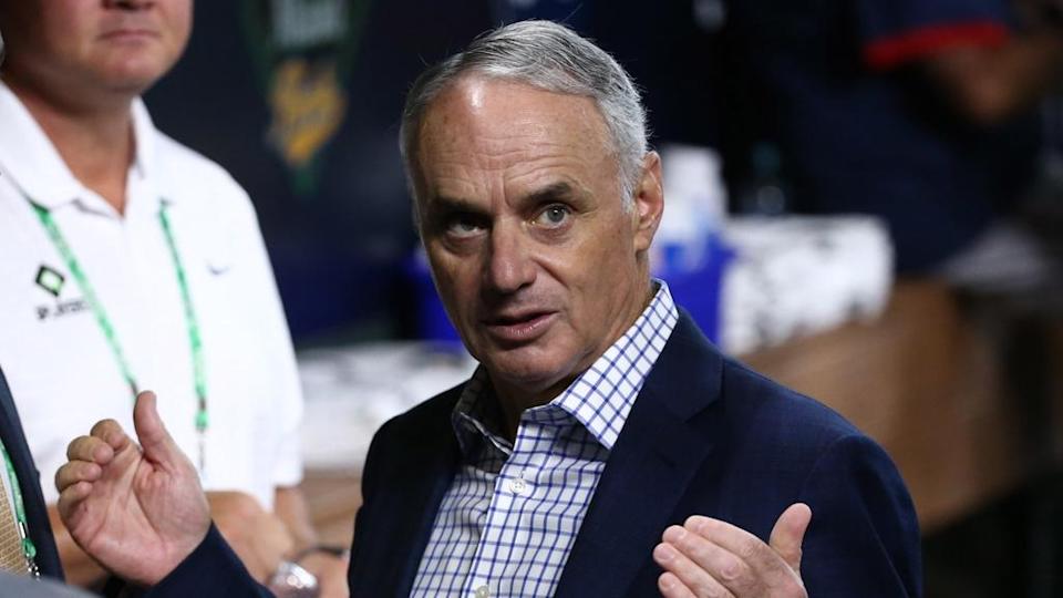 Rob Manfred in dugout gesturing 2021 playoffs