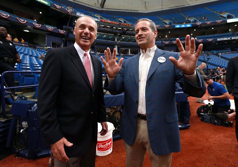 Tampa Bay Rays owner Stuart Sternberg, right, chats with MLB commissioner Rob Manfred, left, at Tropicana Field on April 3, 2016.