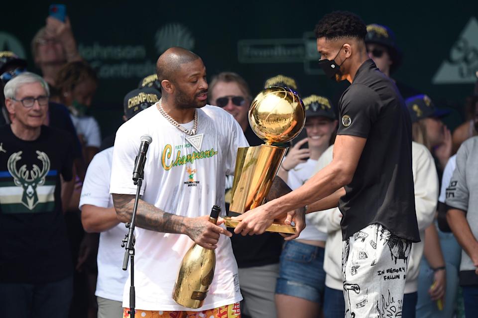 The acquisition of P.J. Tucker (left) near the trade deadline last season helped Giannis Antetokounmpo and the Bucks win the NBA title.