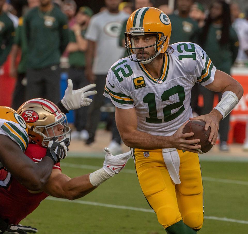 The Green Bay Packers are favored in their NFL playoff divisional-round game against the San Francisco 49ers on Saturday.