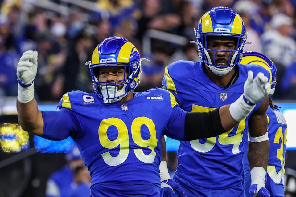 Aaron Donald (99) encourages Rams fans to cheer.