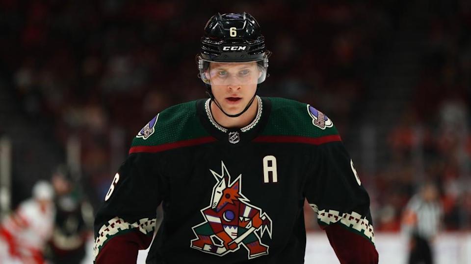 Jakob Chychrun with Coyotes black jersey facing forward 2021