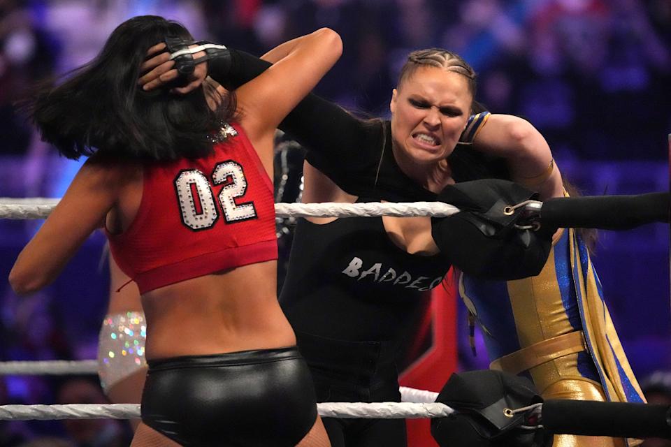 Jan 29, 2022; St. Louis, MO, USA; Ronda Rousey battles competitors during the women’s Royal Rumble match during the Royal Rumble at The Dome at America's Center. Mandatory Credit: Joe Camporeale-USA TODAY Sports