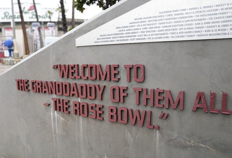 A sign honors broadcaster Keith Jackson outside the Rose Bowl stadium in Pasadena, Calif. on Dec. 30, 2021.