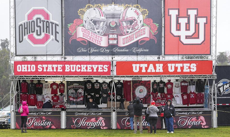 Fans purchase Ohio State and Utah merchandise outside the Rose Bowl stadium in Pasadena, Calif. on Dec. 30, 2021.