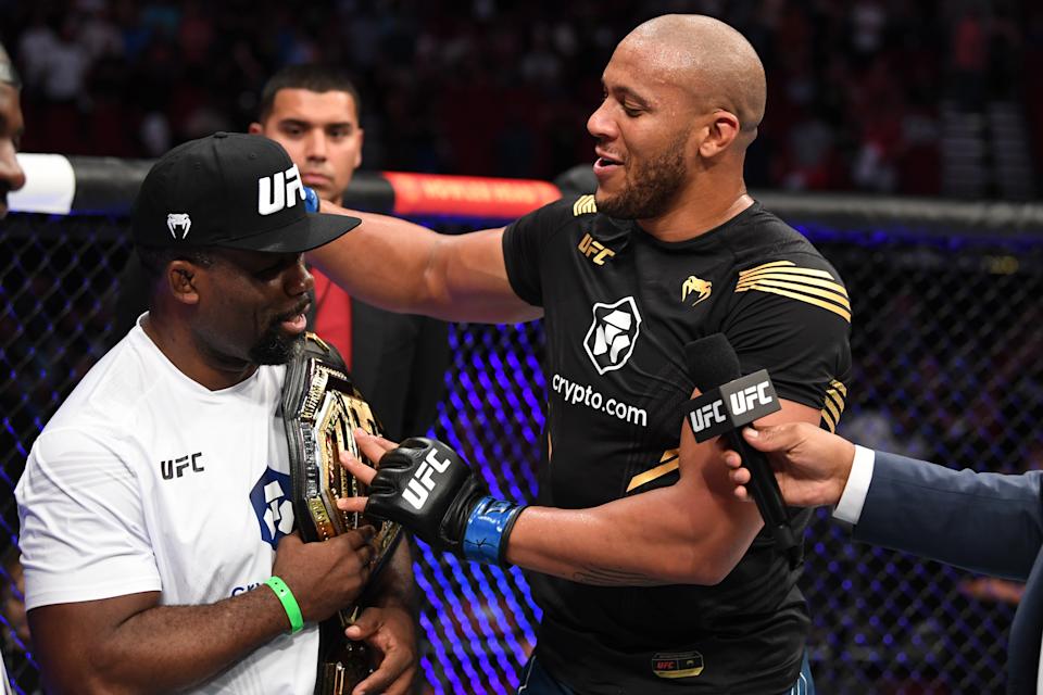 (R-L) Ciryl Gane of France interacts with his coach Fernand Lopez after defeating Derrick Lewis in their interim heavyweight title bout during the UFC 265 event at Toyota Center on August 07, 2021 in Houston, Texas. (Photo by Josh Hedges/Zuffa LLC)