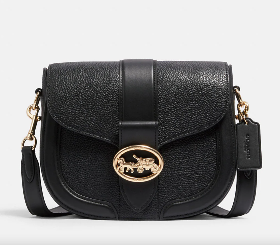 Georgie Saddle Bag in black leather with gold coach emblem (Photo via Coach Outlet)