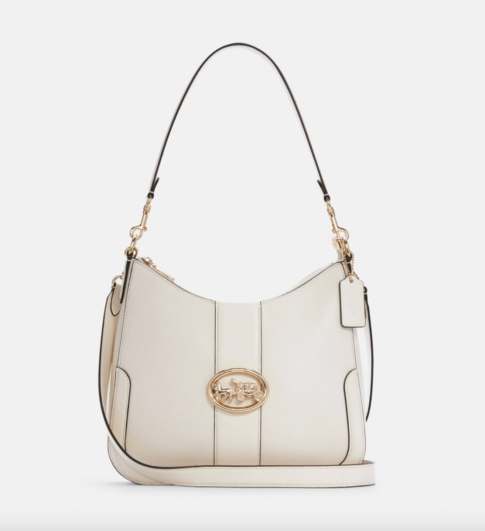 Georgie Hobo in white leather with gold buckle (Photo via Coach Outlet)