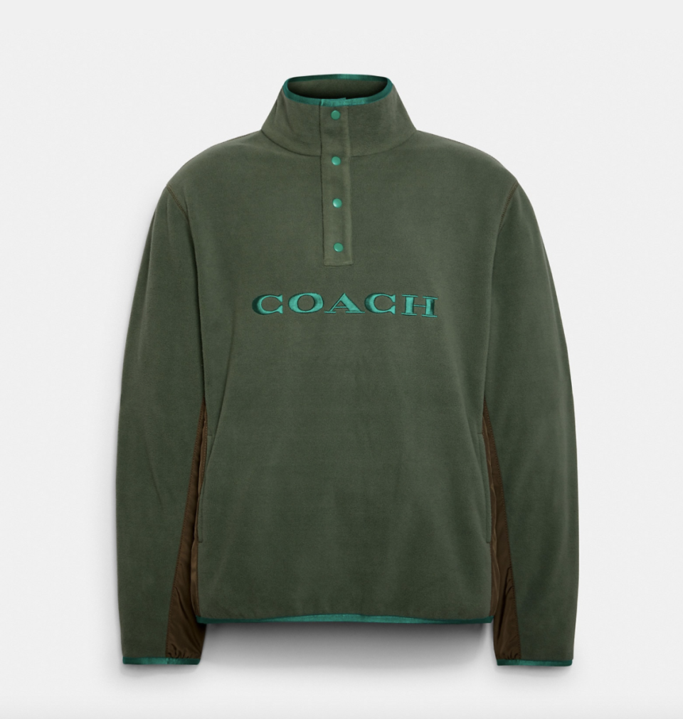 Fleece Popover in dark forest green (Photo via Coach Outlet)