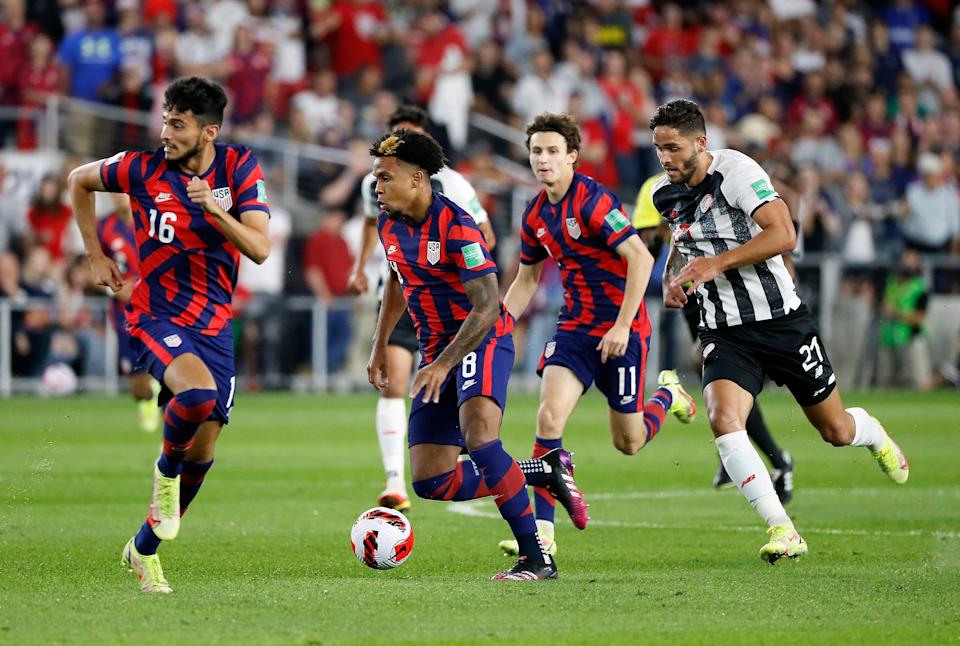 United States' midfielder Weston McKennie (8) gets past Costa Rica's forward Jonathan Moya (21) in the first half of their World Cup qualifier at Lower.com Field in Columbus, Ohio on October 13, 2021. 