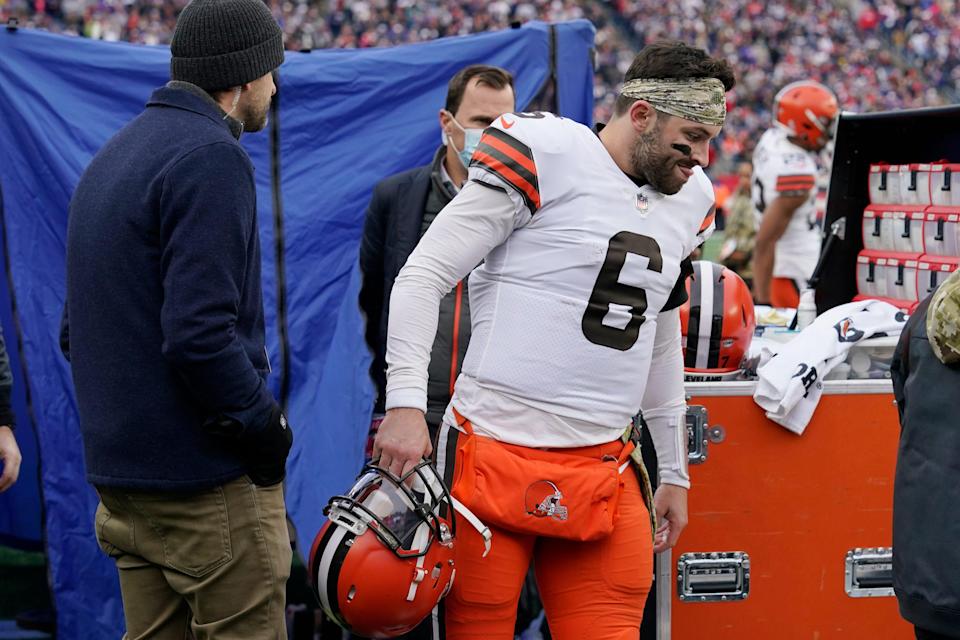 Cleveland Browns quarterback Baker Mayfield (6) walks out of the medical tent after being examined during the second half of an NFL football game against the New England Patriots, Sunday, Nov. 14, 2021, in Foxborough, Mass. (AP Photo/Steven Senne)