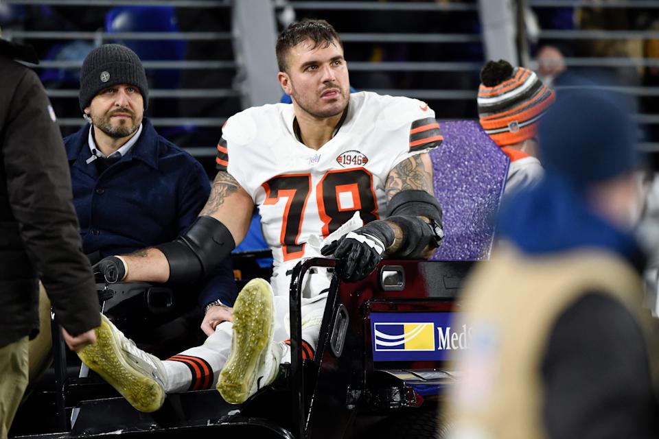 Cleveland Browns offensive tackle Jack Conklin leaves the field on a cart during the first half of an NFL football game against the Baltimore Ravens, Sunday, Nov. 28, 2021, in Baltimore. (AP Photo/Gail Burton)