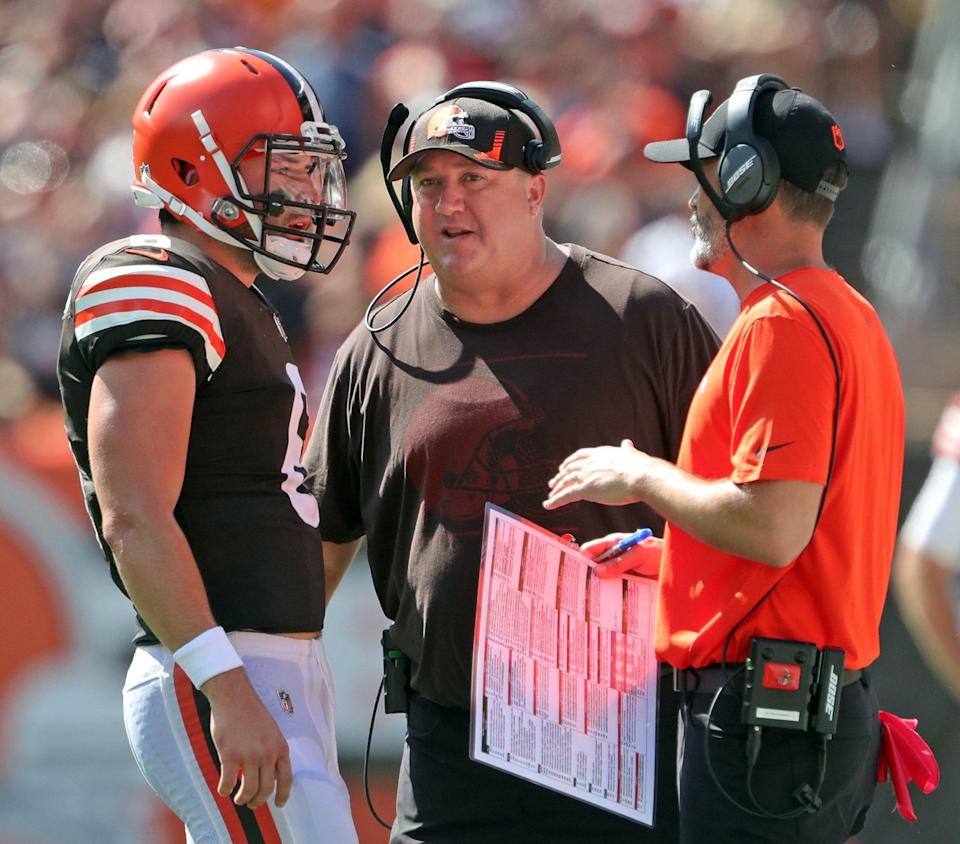 Cleveland Browns quarterback Baker Mayfield (6) meets with Cleveland Browns offensive coordinator Alex Van Pelt, center, and Cleveland Browns head coach Kevin Stefanski during the first half of an NFL football game against the Houston Texans, Sunday, Sept. 19, 2021, in Cleveland, Ohio. [Jeff Lange/Beacon Journal]