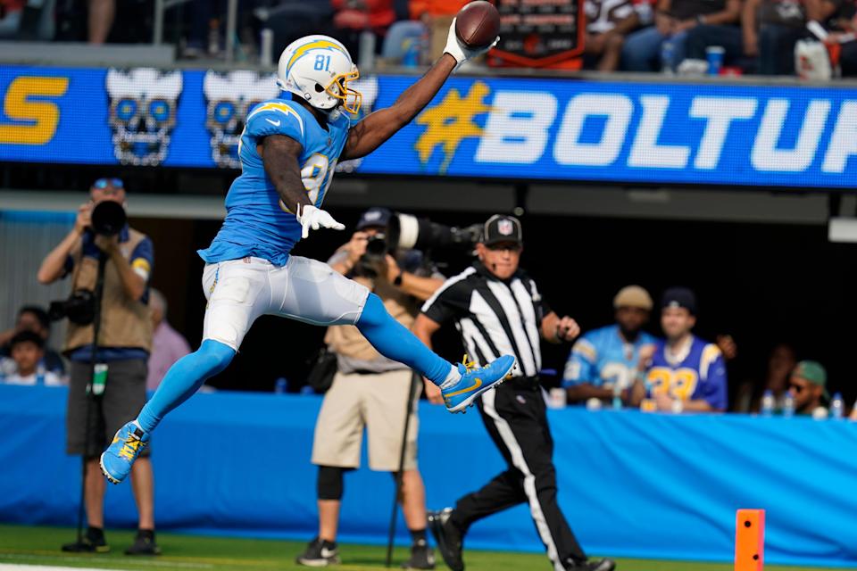 Los Angeles Chargers wide receiver Mike Williams leaps into the end zone to score a touchdown during the second half of an NFL football game against the Cleveland Browns Sunday, Oct. 10, 2021, in Inglewood, Calif. (AP Photo/Gregory Bull)