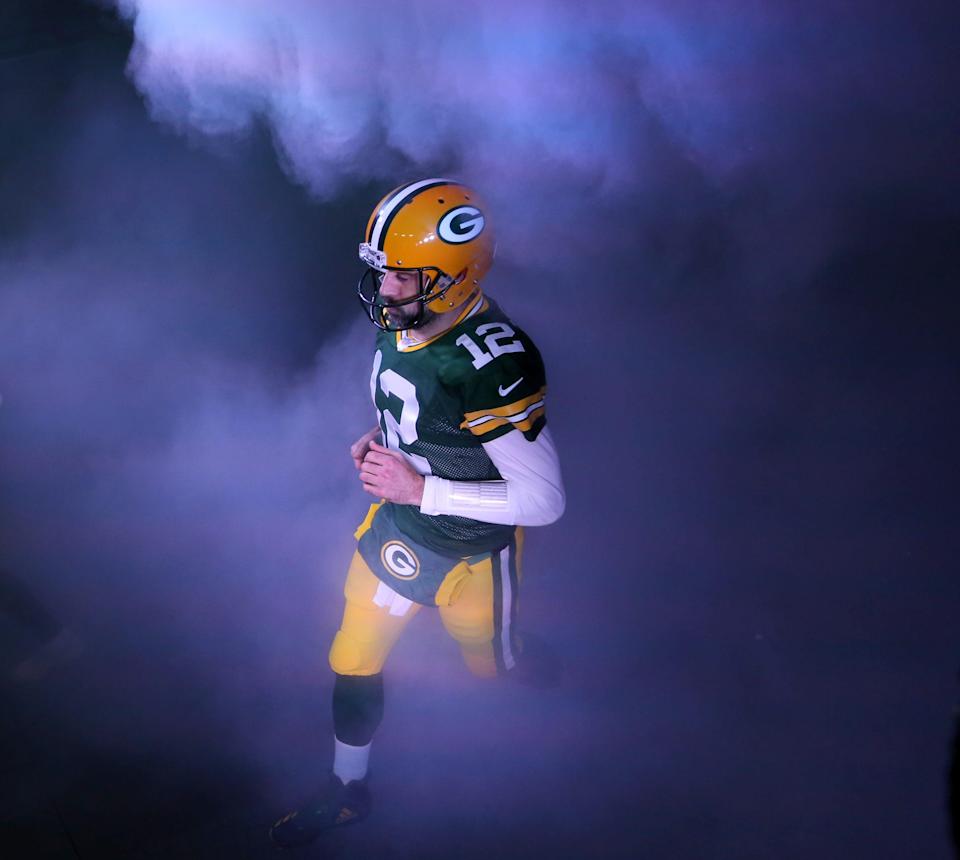 Green Bay Packers quarterback Aaron Rodgers runs onto the field before the NFC divisional playoff game against the Los Angeles Rams on Saturday, Jan. 16, 2021 at Lambeau Field in Green bay, Wis. The Packers won 32-18.