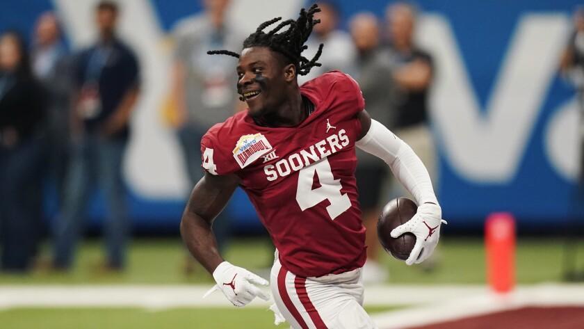 Oklahoma wide receiver Mario Williams (4) after losing his helmet on a play during the first half of the Alamo Bowl NCAA college football game against Oregon, Wednesday, Dec. 29, 2021, in San Antonio. (AP Photo/Eric Gay)