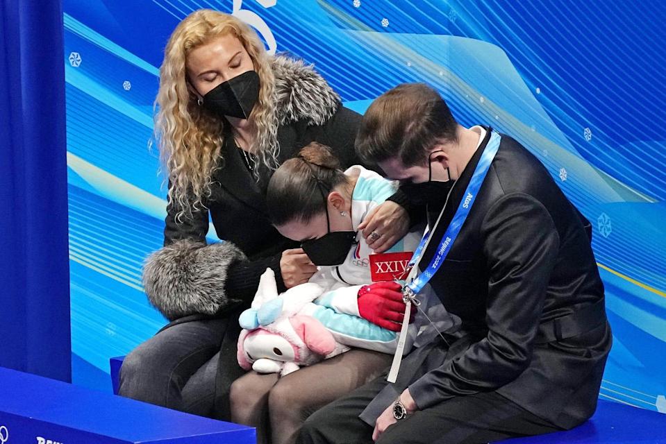 Kamila Valieva (ROC) reacts in the kiss and cry area in the women's figure skating free program during the Beijing 2022 Olympic Winter Games at Capital Indoor Stadium.