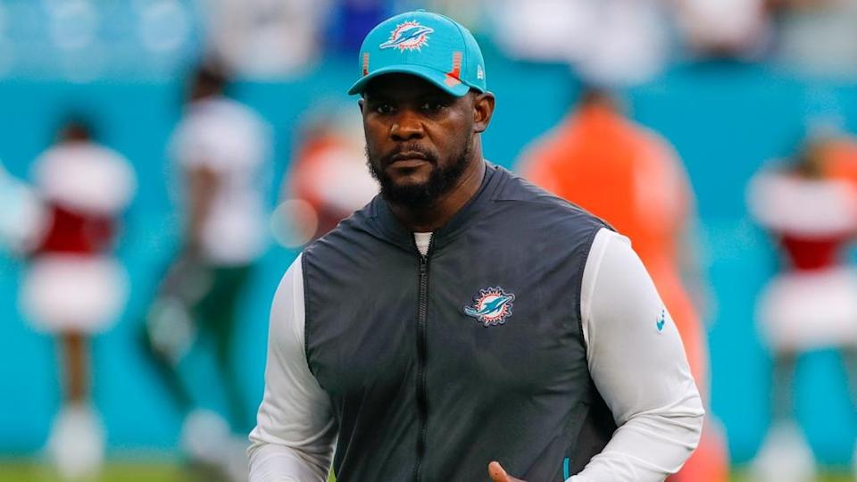 Dec 19, 2021; Miami Gardens, Florida, USA; Miami Dolphins head coach Brian Flores runs off the field after winning the game against the New York Jets at Hard Rock Stadium.