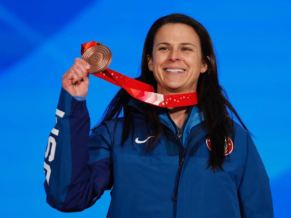 Brittany Bowe poses with her Olympic bronze medal.