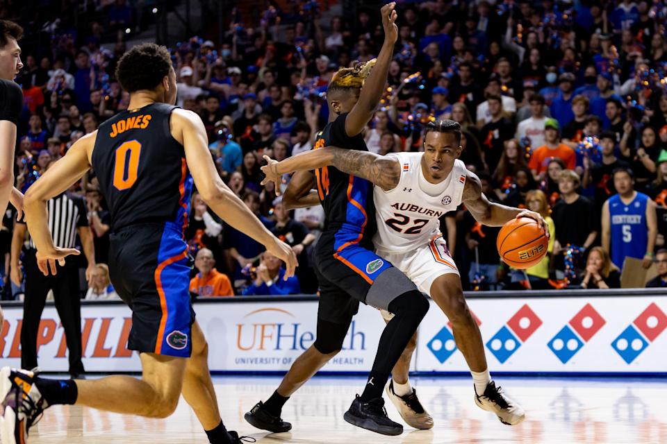 Auburn Tigers guard Allen Flanigan (22) dribbles the ball during the first half against the Florida Gators at Billy Donovan Court at Exactech Arena.