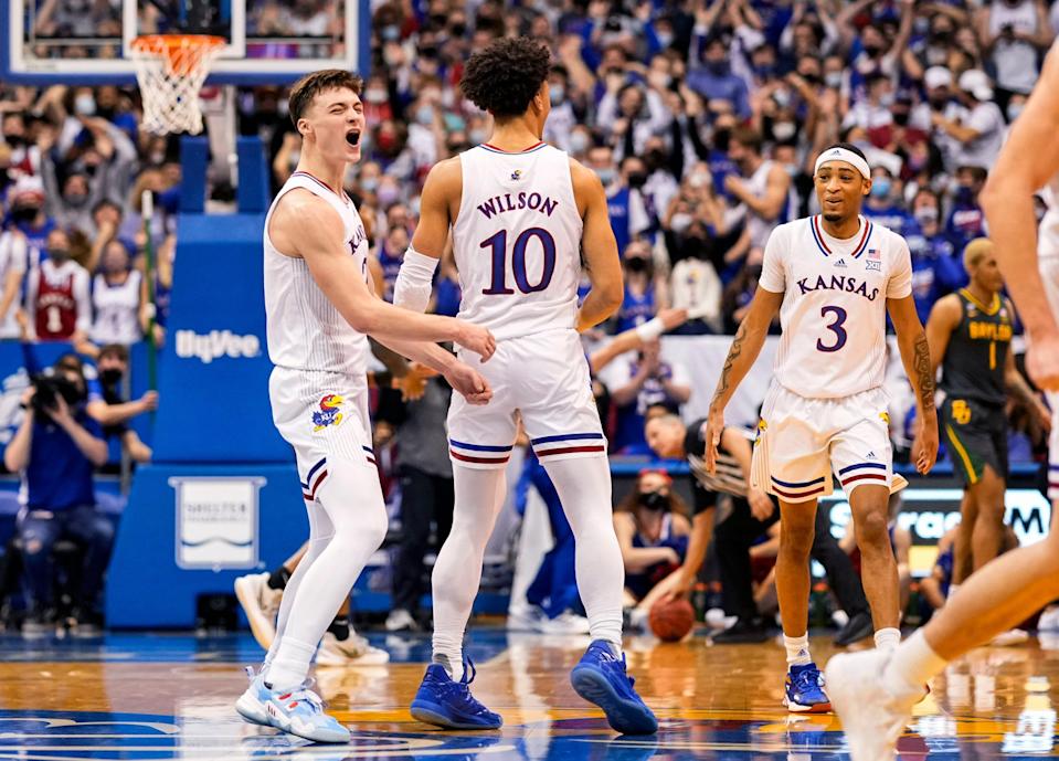 Kansas Jayhawks guard Christian Braun (2) celebrates with teammates after scoring against the Baylor Bears during the first half at Allen Fieldhouse.