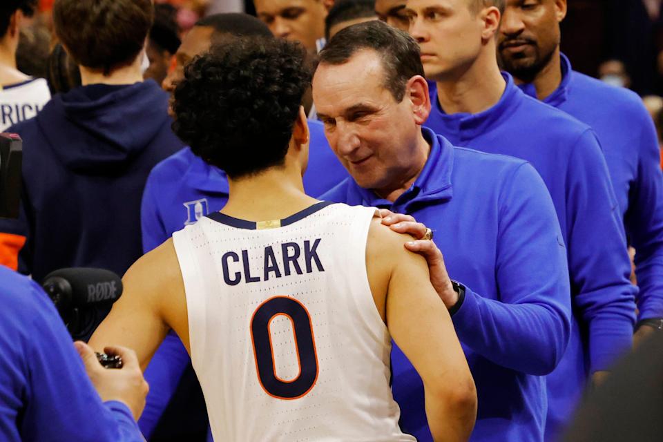 Duke head coach Mike Krzyzewski talks with Virginia guard Kihei Clark in the handshake line after their game at John Paul Jones Arena.