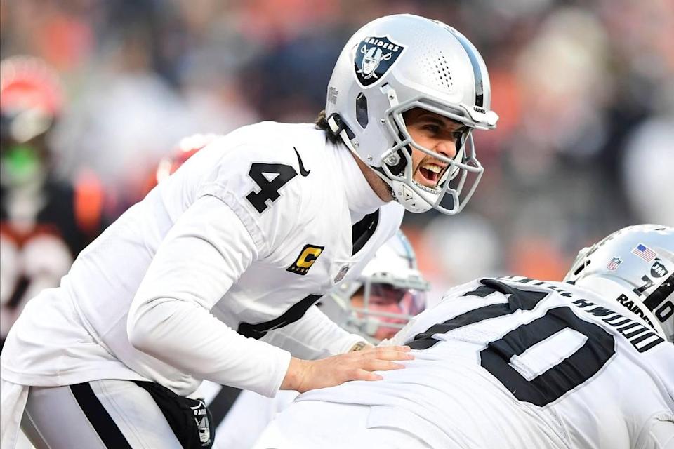 Las Vegas Raiders quarterback Derek Carr calls a play during an NFL wild-card playoff football game against the Cincinnati Bengals, Saturday, Jan. 15, 2022, in Cincinnati.