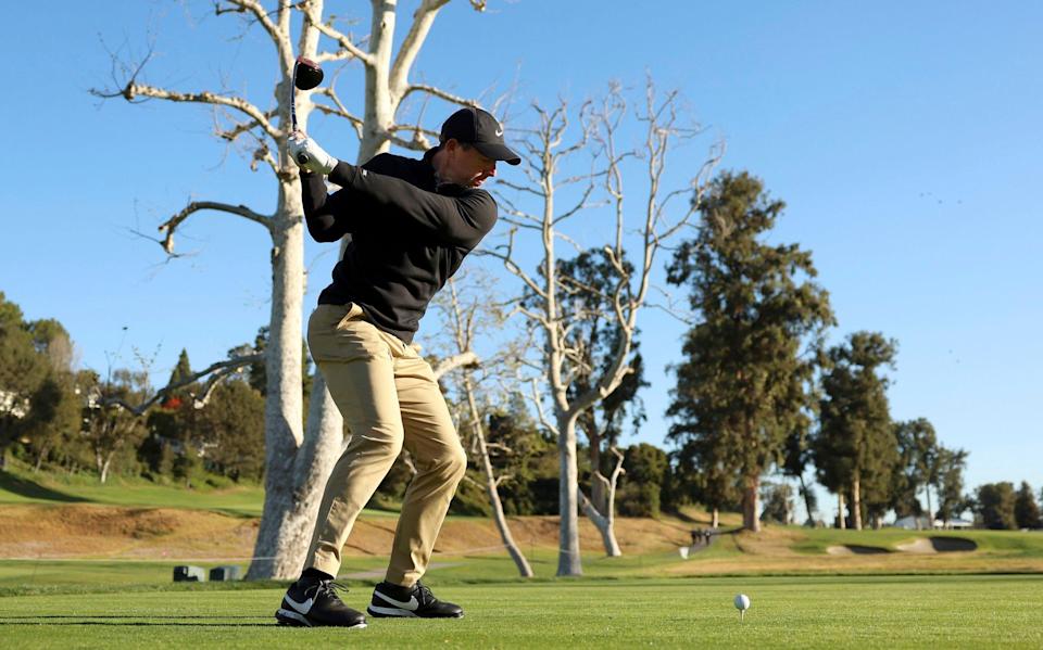 Rory McIlroy, of Northern Ireland, tees off on the 17th hole during the Genesis Invitational pro-am golf event at Riviera Country Club, Wednesday, Feb. 16, 2022, in the Pacific Palisades area of Los Angeles - AP