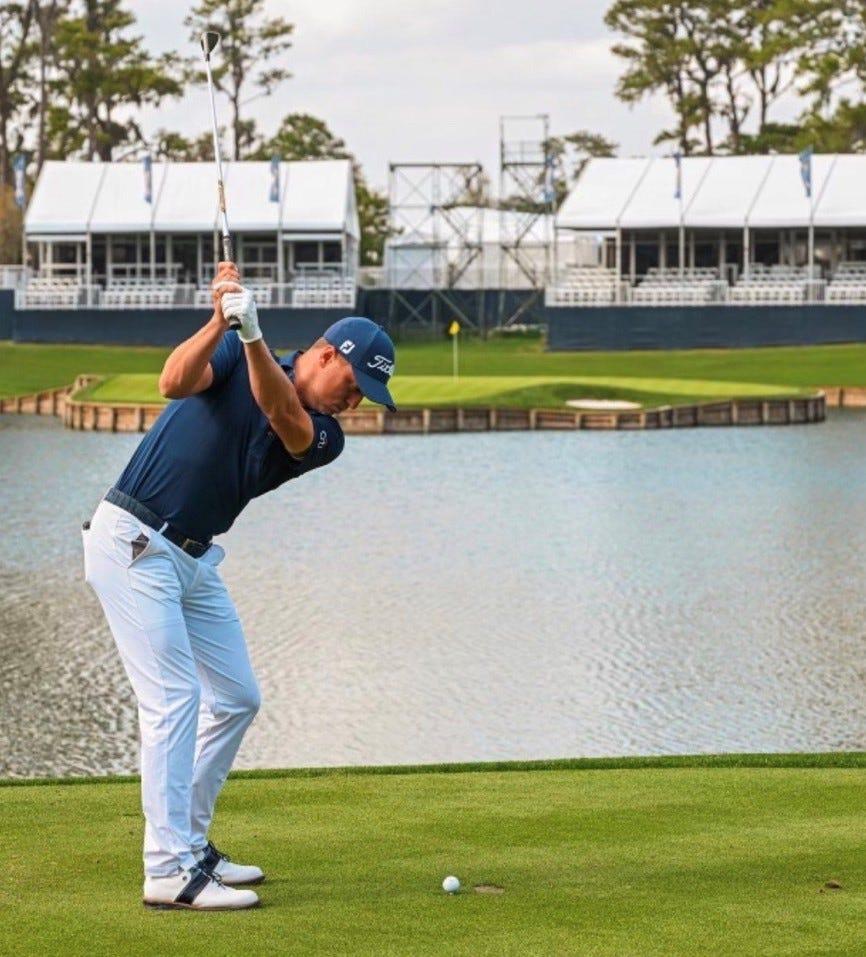 Justin Thomas hits a shot to the 17th hole of the Players Stadium Course at TPC Sawgrass during a visit to the area on Wednesday.