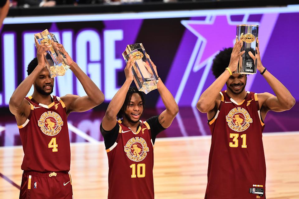 Evan Mobley (4), Darius Garland (10) and Jarrett Allen (31) of the hometown Team Cavs celebrate after winning the Skills Challenge.