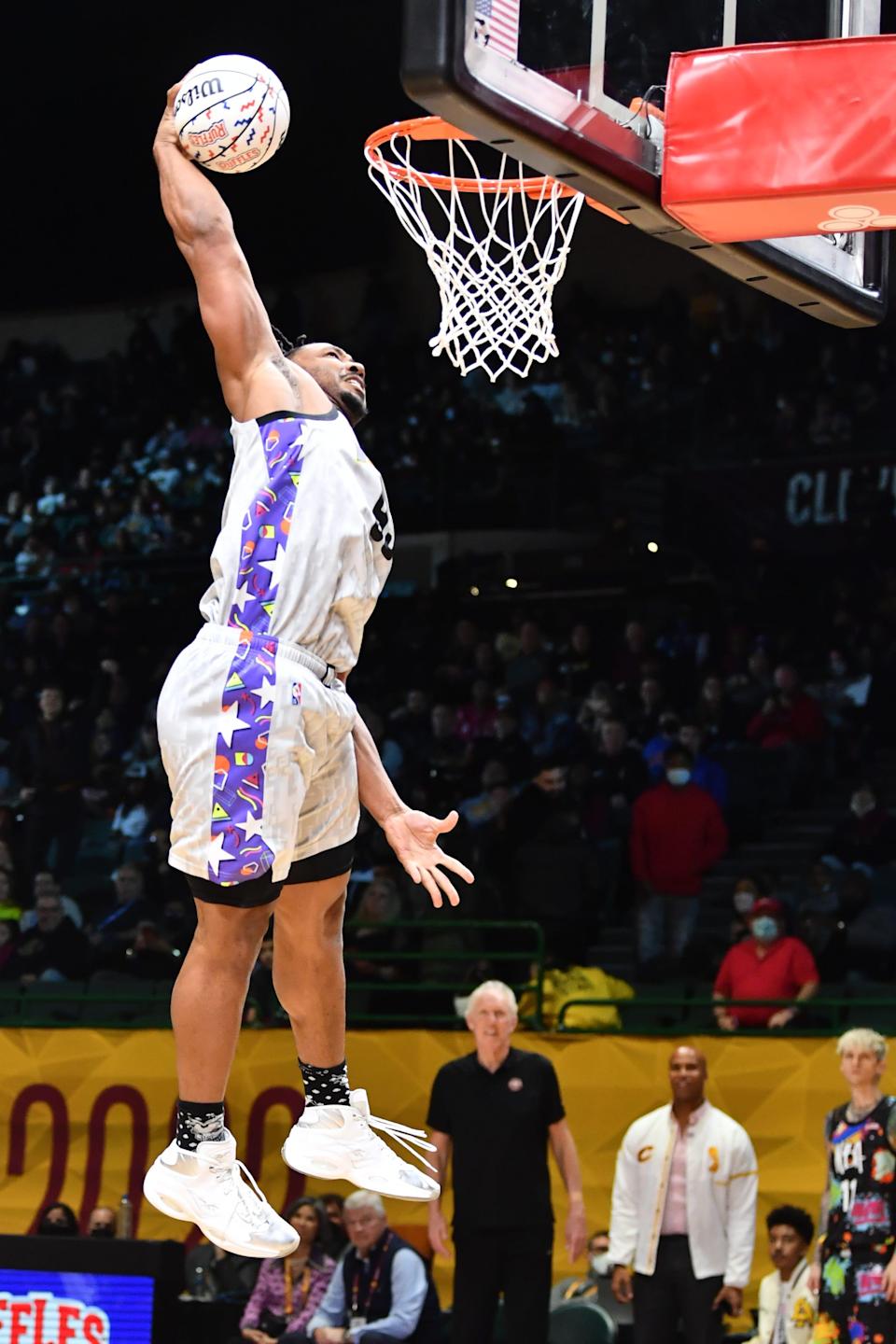 Cleveland Browns star Myles Garrett throws down a one-handed slam during the Ruffles NBA All-Star Celebrity Game.