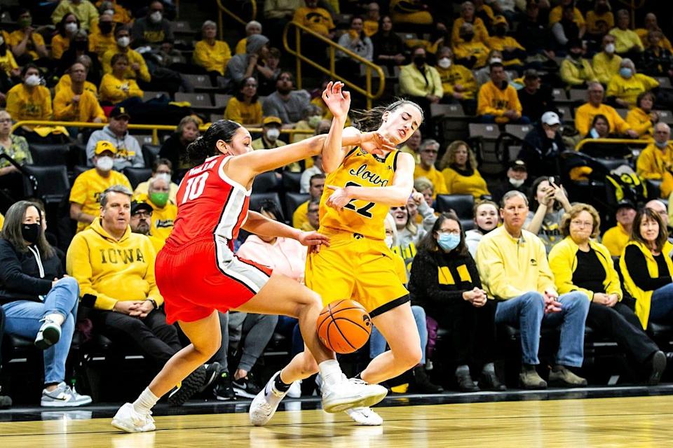 Iowa guard Caitlin Clark, right, gets tangled up with Ohio State guard Braxtin Miller (10) during a NCAA Big Ten Conference women's basketball game, Monday, Jan. 31, 2022, at Carver-Hawkeye Arena in Iowa City, Iowa. 220131 Ohio St Iowa Wbb 005 Jpg