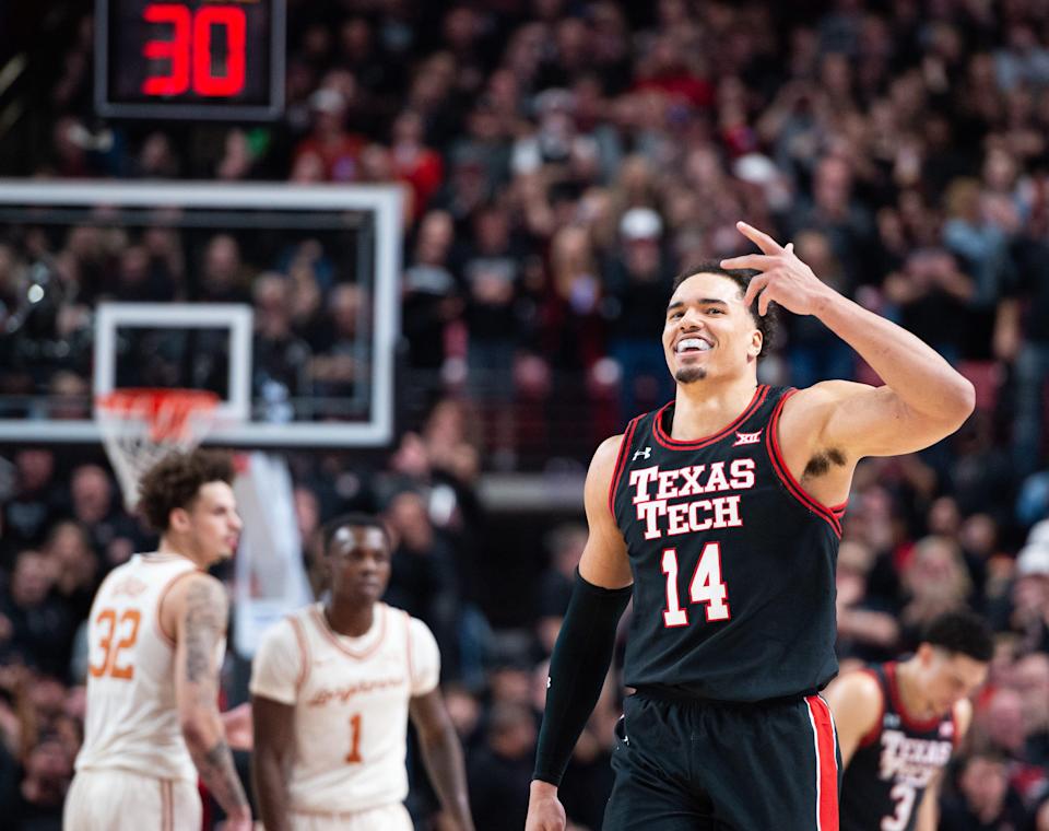 Texas Tech's Marcus Santos-Silva (14) celebrates after a play at the game on Tuesday, Feb. 1, 2022, at United Supermarkets Arena in Lubbock, Texas.