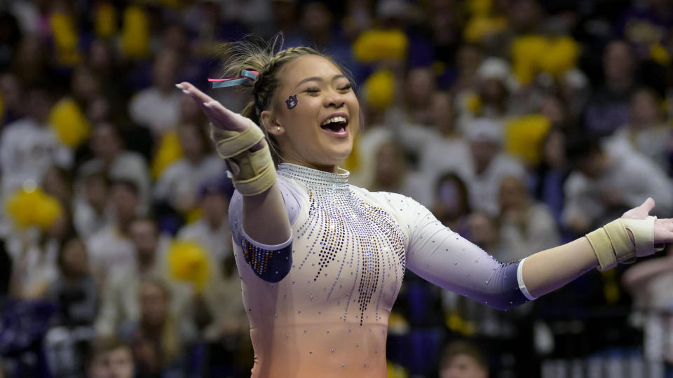 Auburn gymnast Sunisa Lee, the 2020 Tokyo Olympics all-around champion, celebrates her vault during an NCAA gymnastics meet against LSU on Saturday, Feb. 5, 2022, in Baton Rouge, La. (AP Photo/Matthew Hinton)