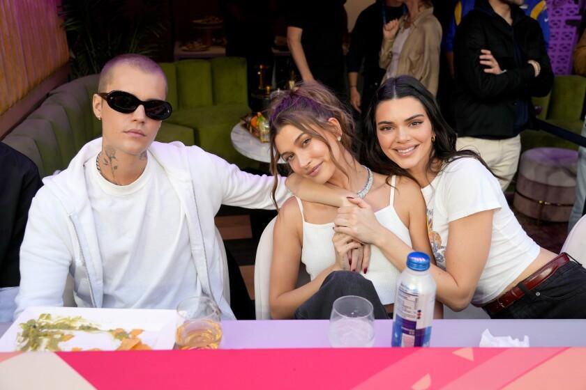 INGLEWOOD, CALIFORNIA - FEBRUARY 13: Justin Bieber, Hailey Bieber and Kendall Jenner attend Super Bowl LVI at SoFi Stadium on February 13, 2022 in Inglewood, California. (Photo by Kevin Mazur/Getty Images for Roc Nation)