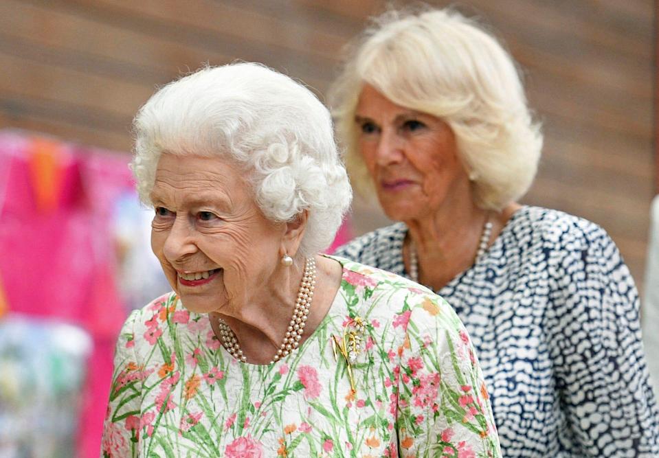 Queen Elizabeth II and her daughter-in-law Camilla, Duchess of Cornwall, attend an event during the G7 summit in Cornwall on June 11, 2021.