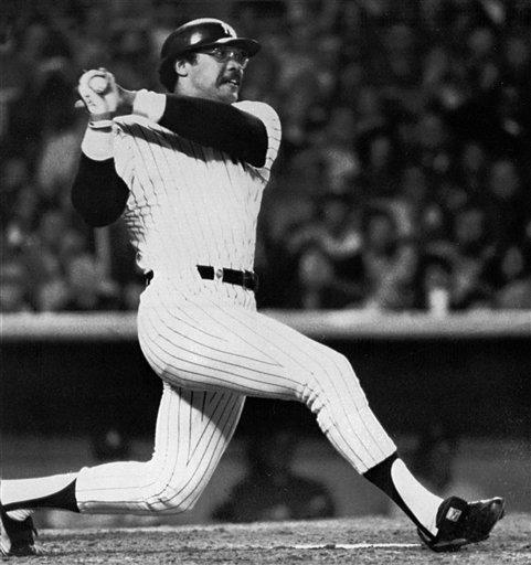 Yankees Reggie Jackson watches the path of the ball as he hits his second homer in the fifth inning of the World Series game in New York on October 18, 1977. The Yankees beat the Dodgers 8-4, to win the world championship.