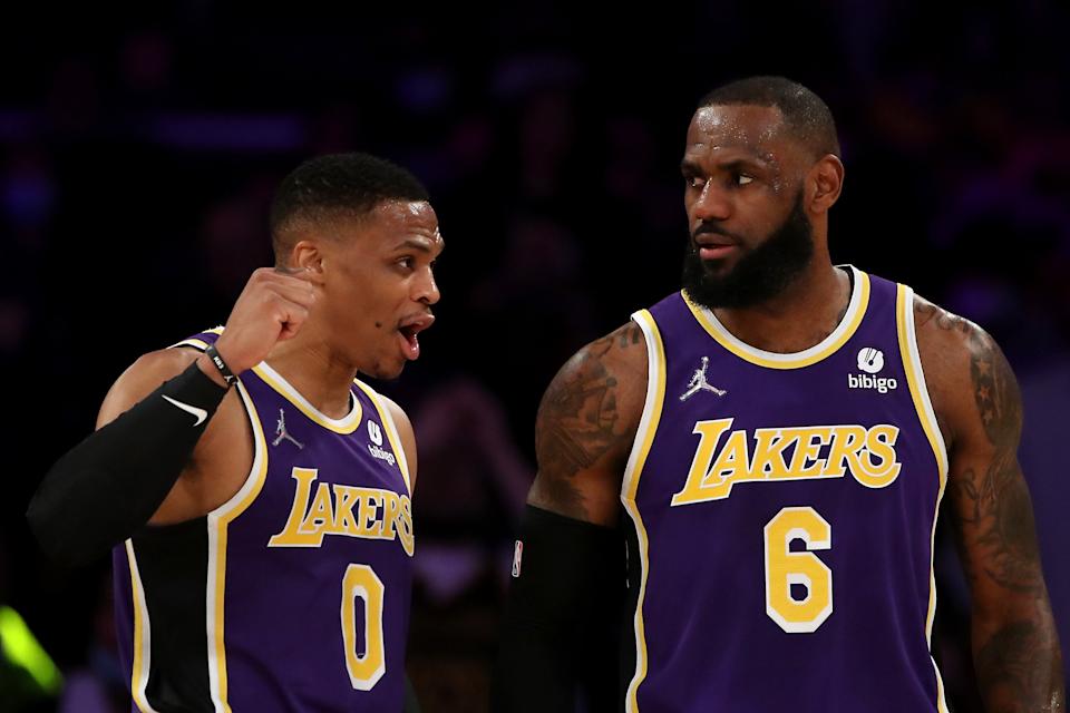 LOS ANGELES, CALIFORNIA - FEBRUARY 16: Russell Westbrook #0 and LeBron James #6 of the Los Angeles Lakers discuss the play during the first quarter against the Utah Jazz at Crypto.com Arena on February 16, 2022 in Los Angeles, California. NOTE TO USER: User expressly acknowledges and agrees that, by downloading and or using this Photograph, user is consenting to the terms and conditions of the Getty Images License Agreement. (Photo by Katelyn Mulcahy/Getty Images)