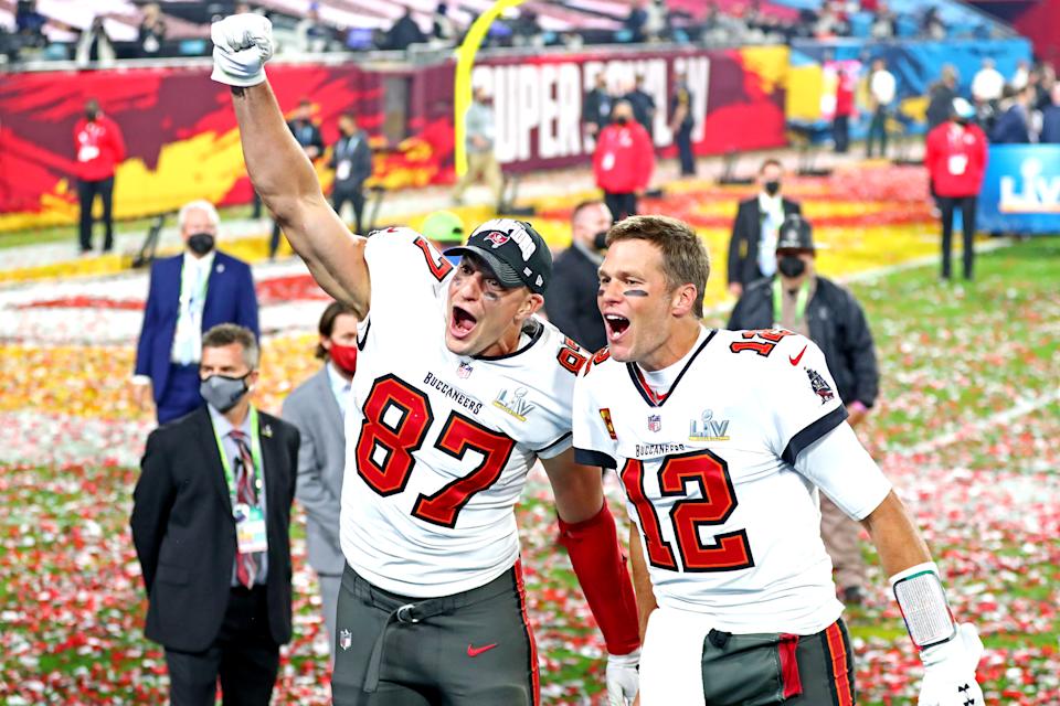 Feb 7, 2021; Tampa, FL, USA; Tampa Bay Buccaneers quarterback Tom Brady (12) and tight end Rob Gronkowski (87) celebrate after beating the Kansas City Chiefs in Super Bowl LV at Raymond James Stadium. Mandatory Credit: Mark J. Rebilas-USA TODAY Sports