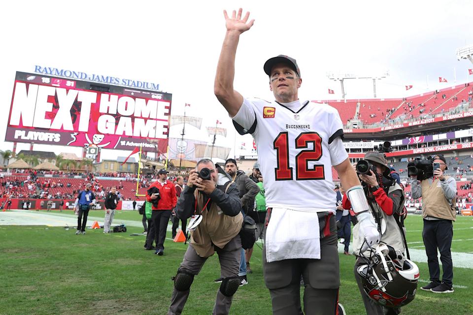 Tom Brady walks off the field after a game.