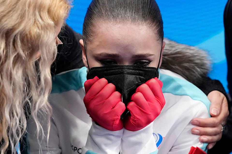 Kamila Valieva, of the Russian Olympic Committee, is consoled by her coach Eteri Tutberidze after losing the women's free skate program during the figure skating competition at the 2022 Winter Olympics.