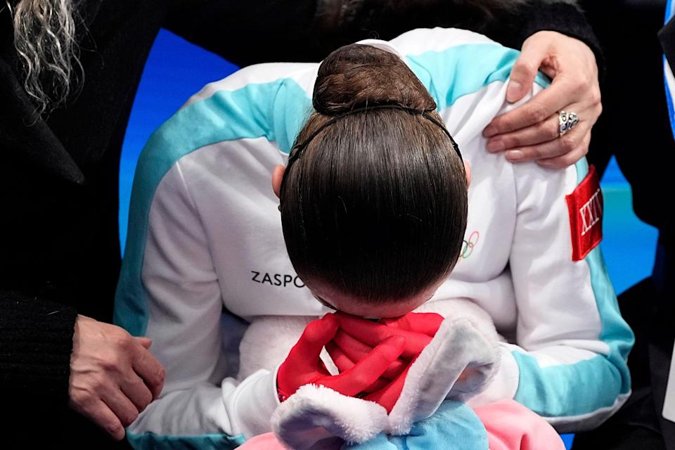 Kamila Valieva, of the Russian Olympic Committee, is consoled by her coach Eteri Tutberidze after competing in the women's free skate program during the figure skating competition at the 2022 Winter Olympics.